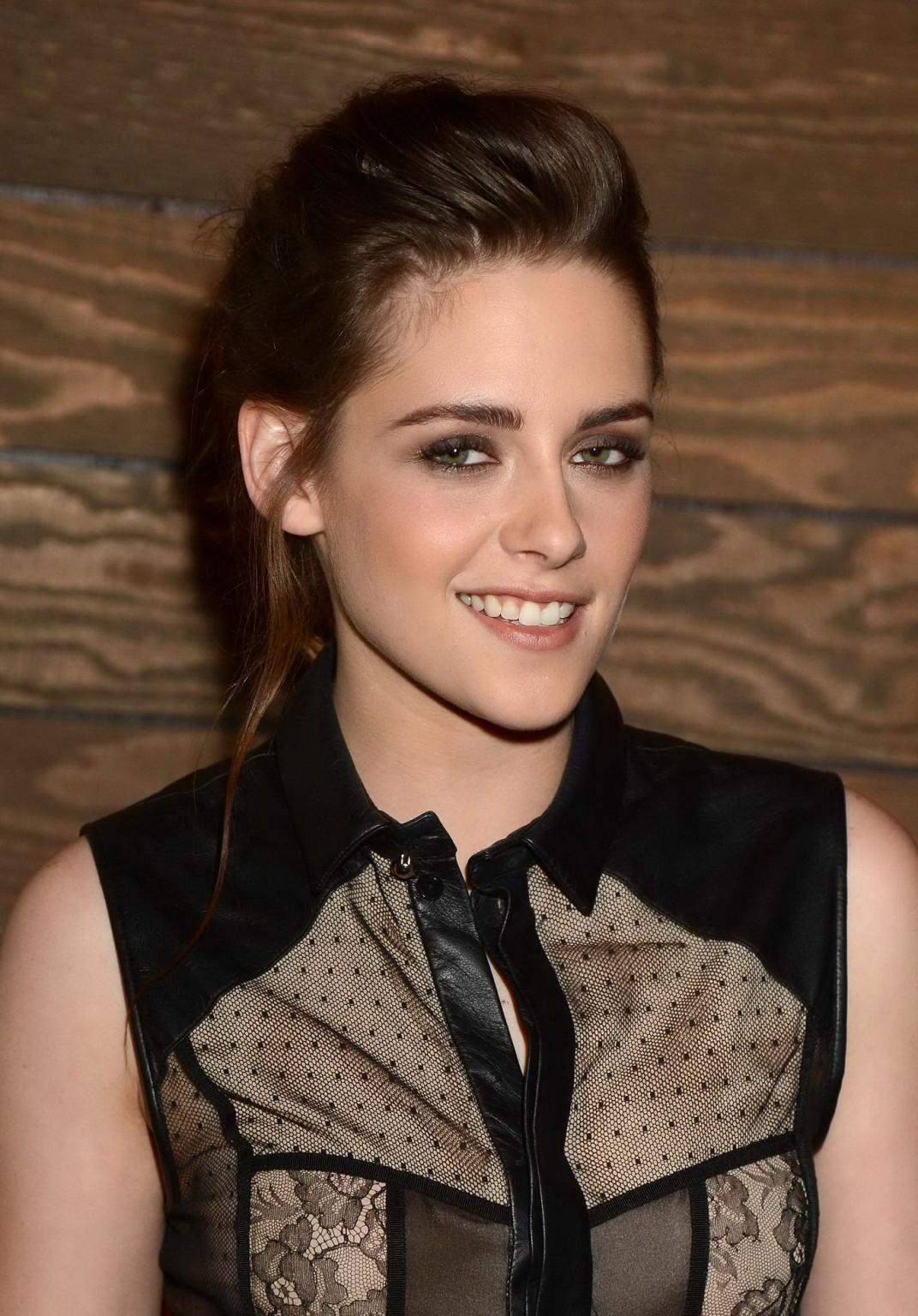 10P Kristen Stewart braless wearing short see-through outfit at On The Road screenin