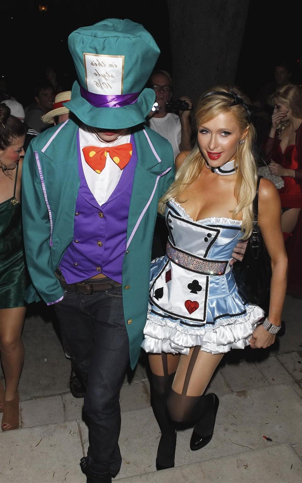 10P Paris Hilton dressed as Alice in Slutland for a Halloween party in Beverly Hills