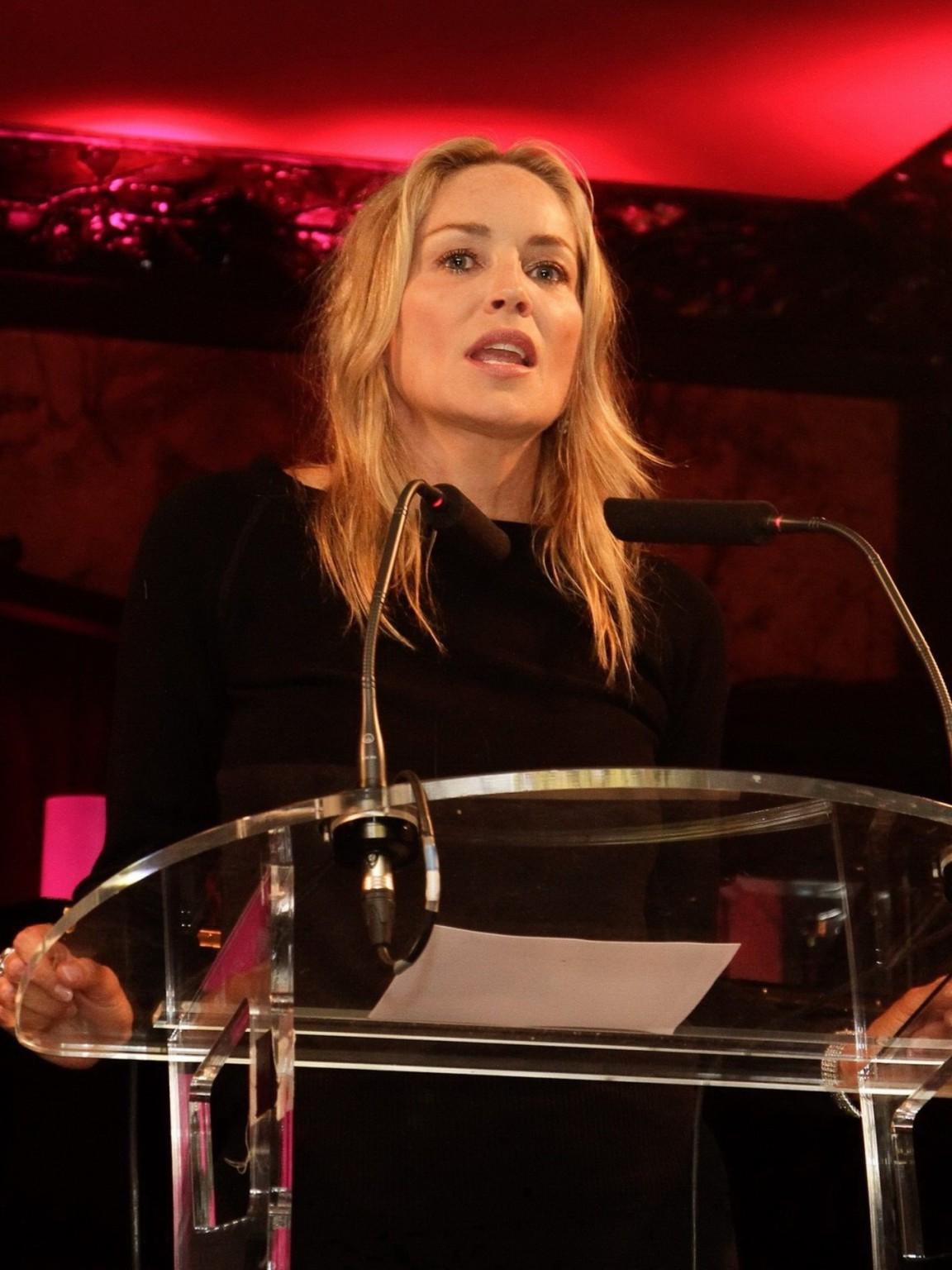 10P Sharon Stone showing off her boobs in see through top at  amfAR Inspiration Nigh