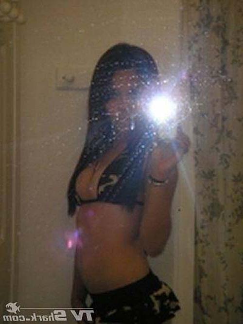 10P Miley Cyrus exposing her tattoo and boobs in see thru