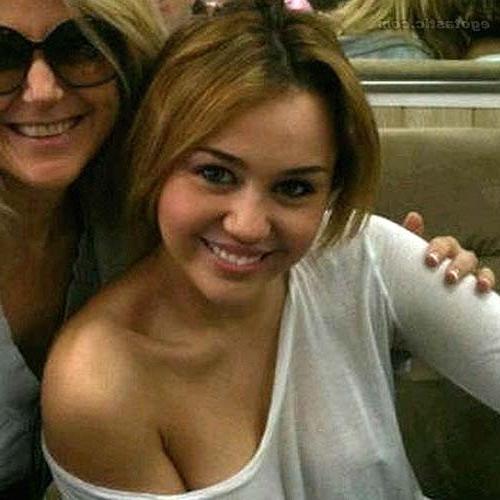 10P Miley Cyrus exposing her tattoo and boobs in see thru