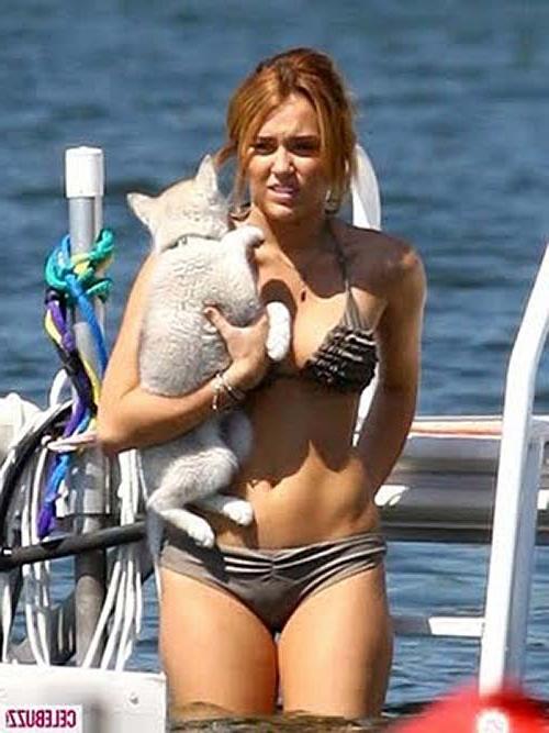 10P Miley Cyrus exposing her tattoo and boobs in see thru