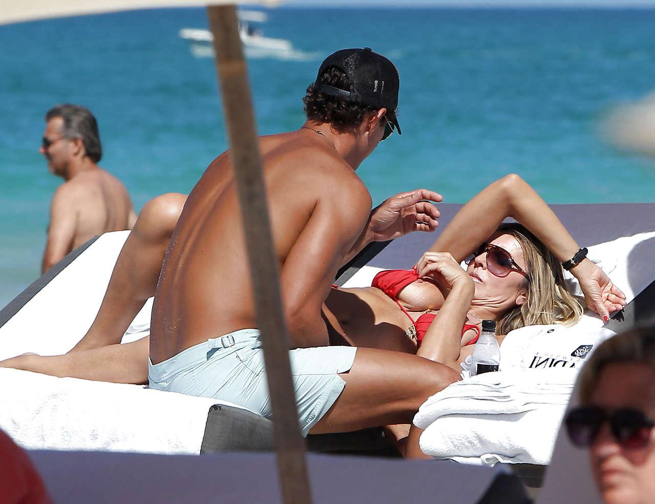 10P Rita Rusic exposing her big tit on beach oops paparazzi pictures