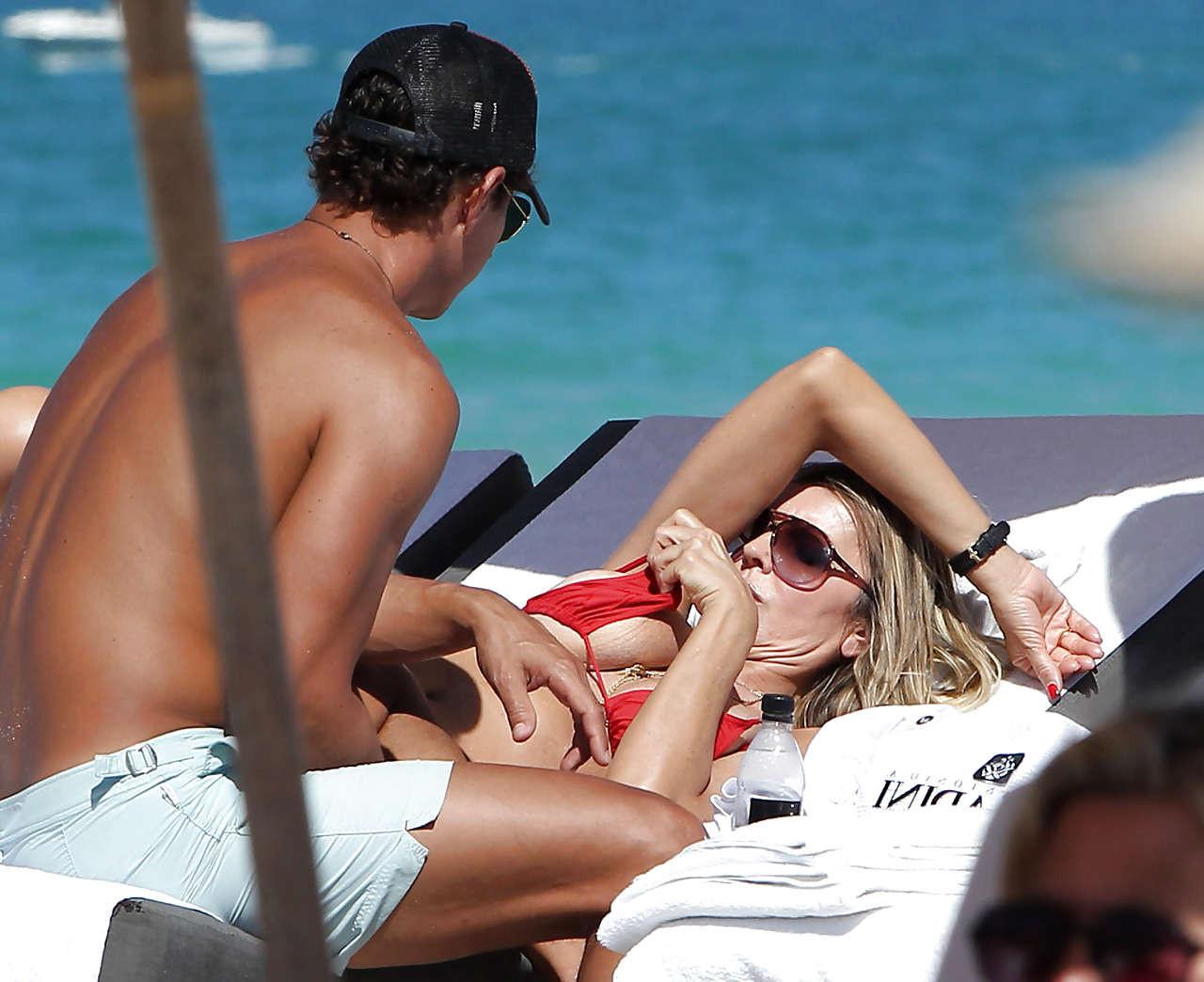 10P Rita Rusic exposing her big tit on beach oops paparazzi pictures