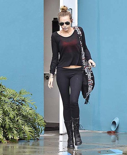 10P Miley Cyrus walking on street in sexy see thru blouse