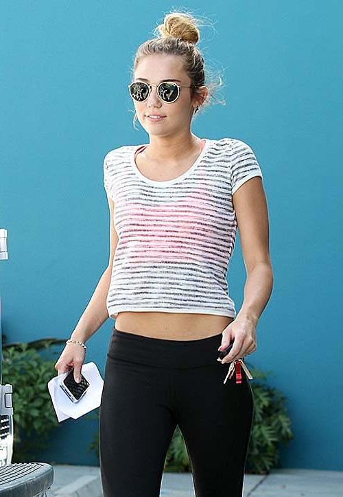 10P Miley Cyrus walking on street in sexy see thru blouse