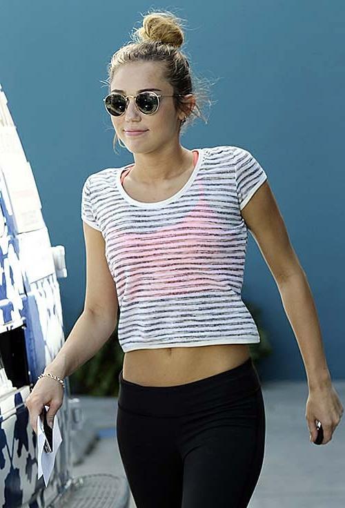 10P Miley Cyrus walking on street in sexy see thru blouse
