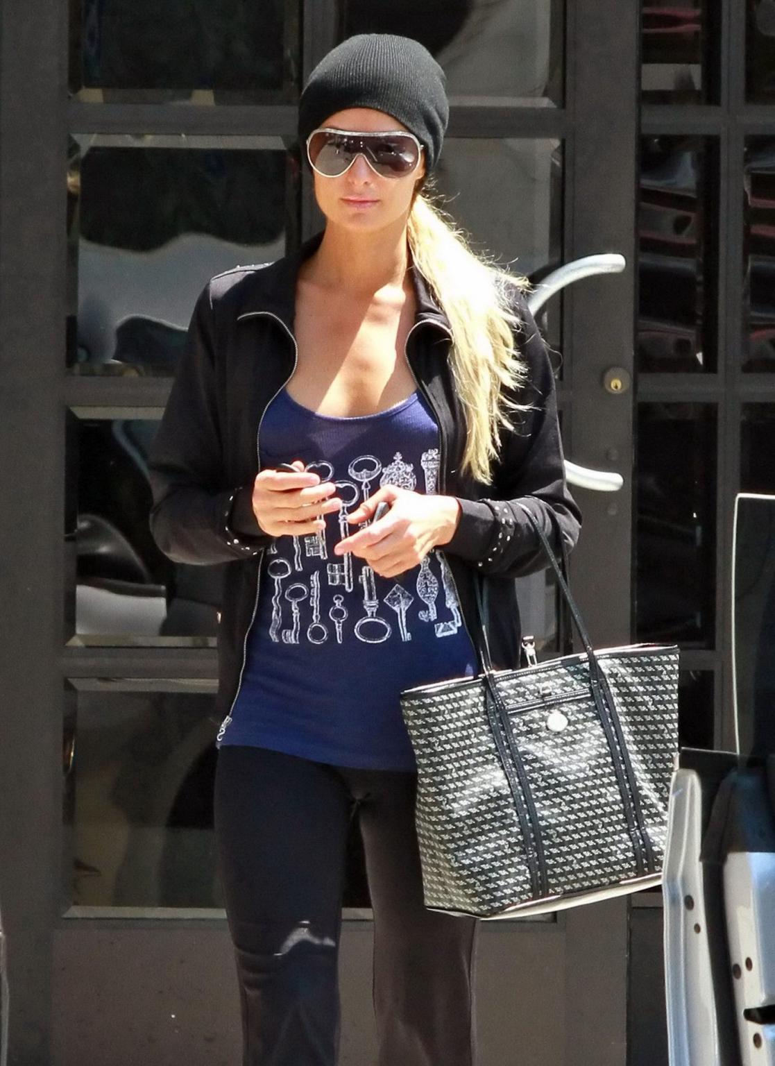 14P Paris Hilton braless wearing a slightly see-through tank top in Beverly Hills