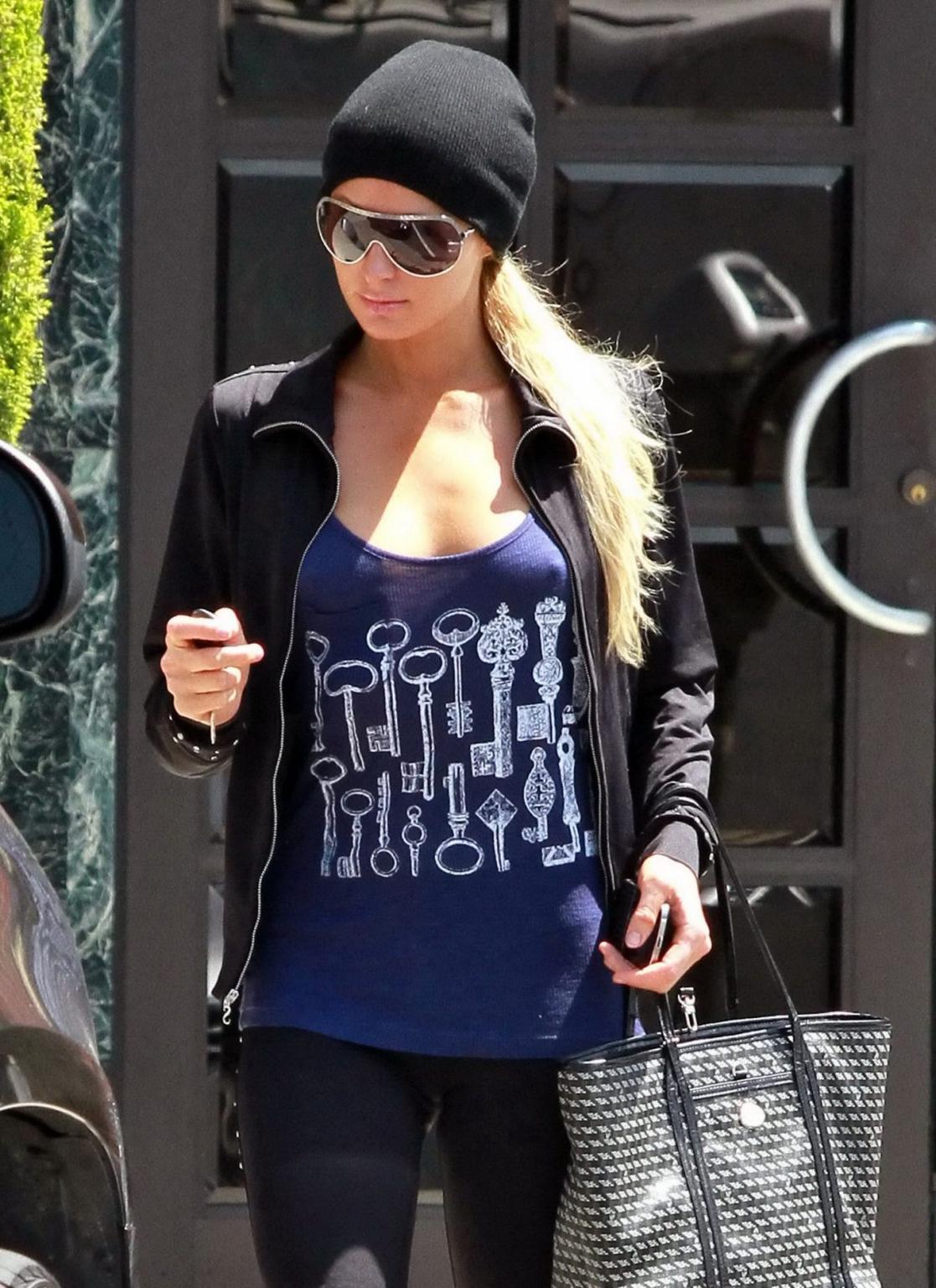 14P Paris Hilton braless wearing a slightly see-through tank top in Beverly Hills