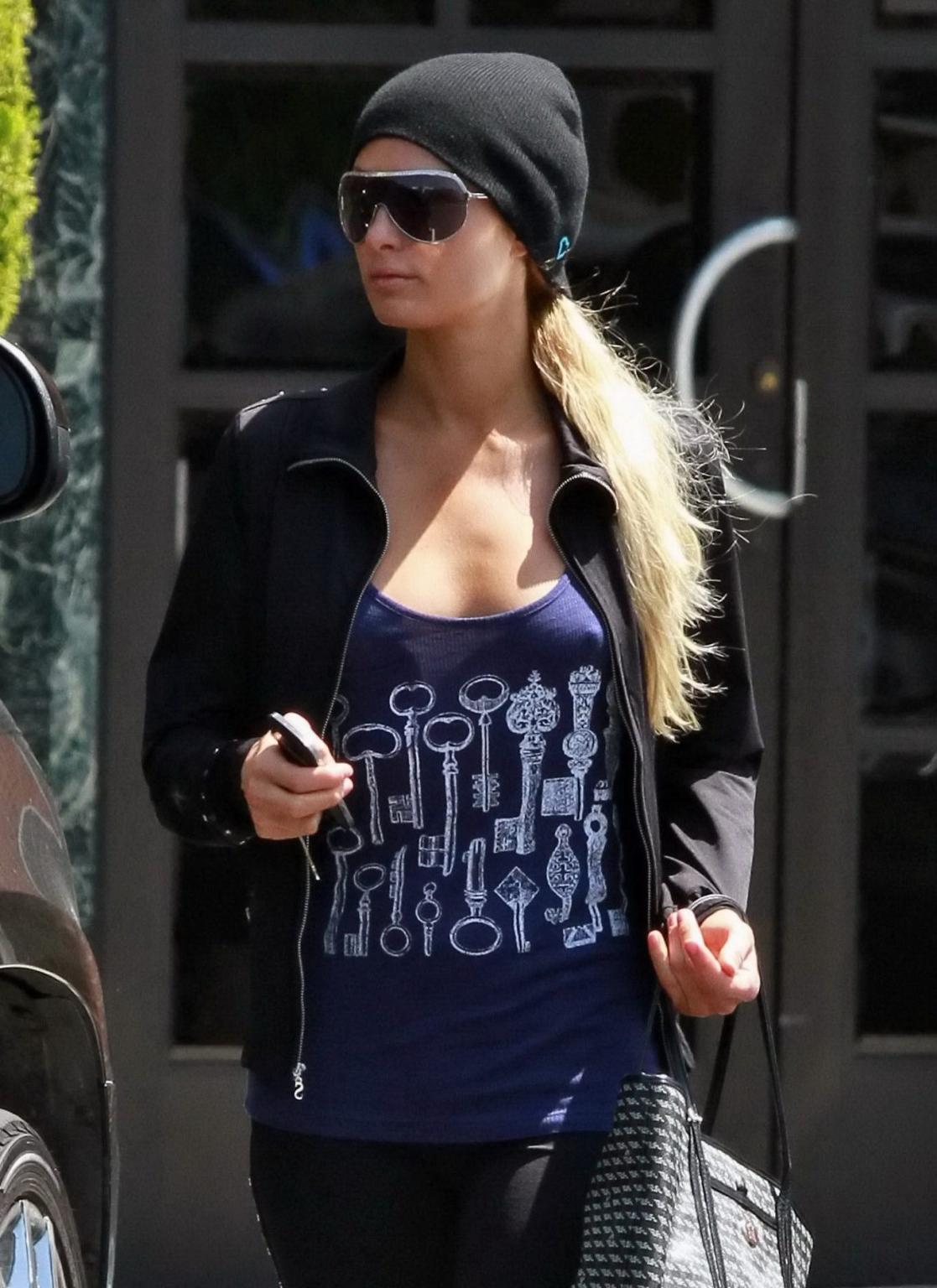 14P Paris Hilton braless wearing a slightly see-through tank top in Beverly Hills
