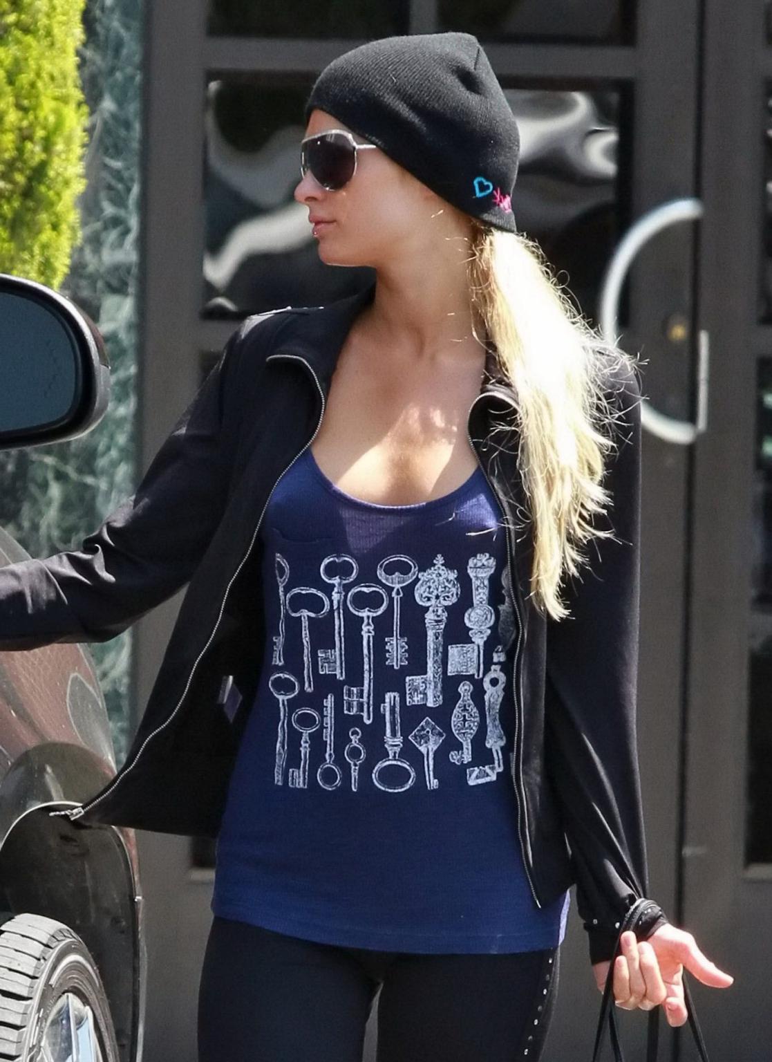 14P Paris Hilton braless wearing a slightly see-through tank top in Beverly Hills