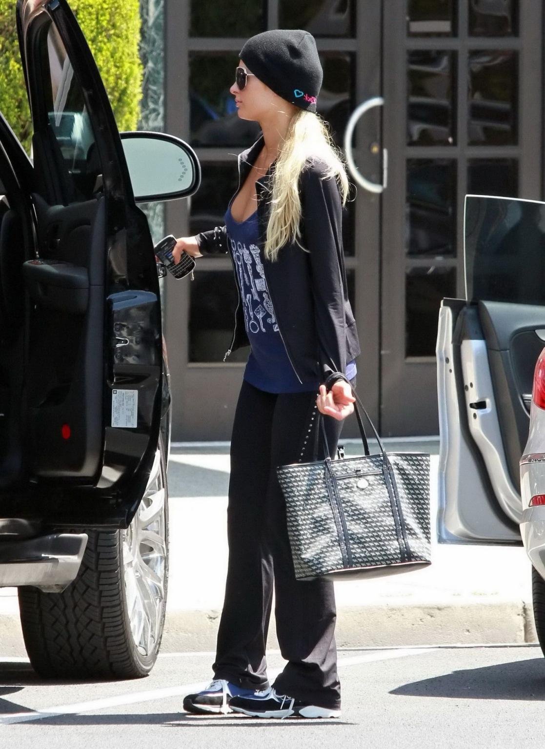 14P Paris Hilton braless wearing a slightly see-through tank top in Beverly Hills