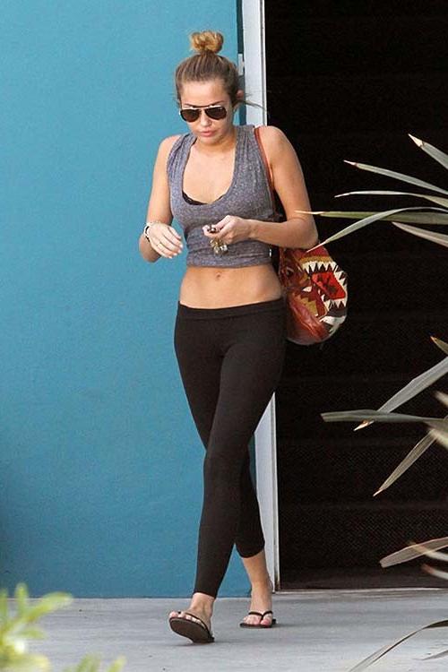 16P Miley Cyrus exposing sexy ass and tiny tits in see thru blouse