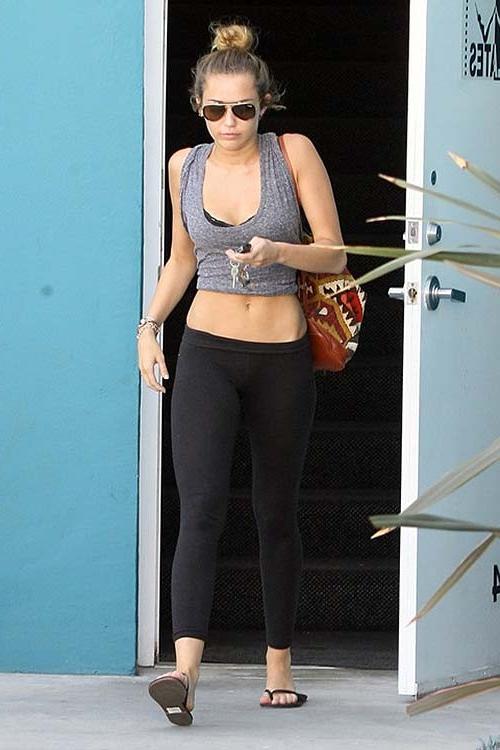 16P Miley Cyrus exposing sexy ass and tiny tits in see thru blouse