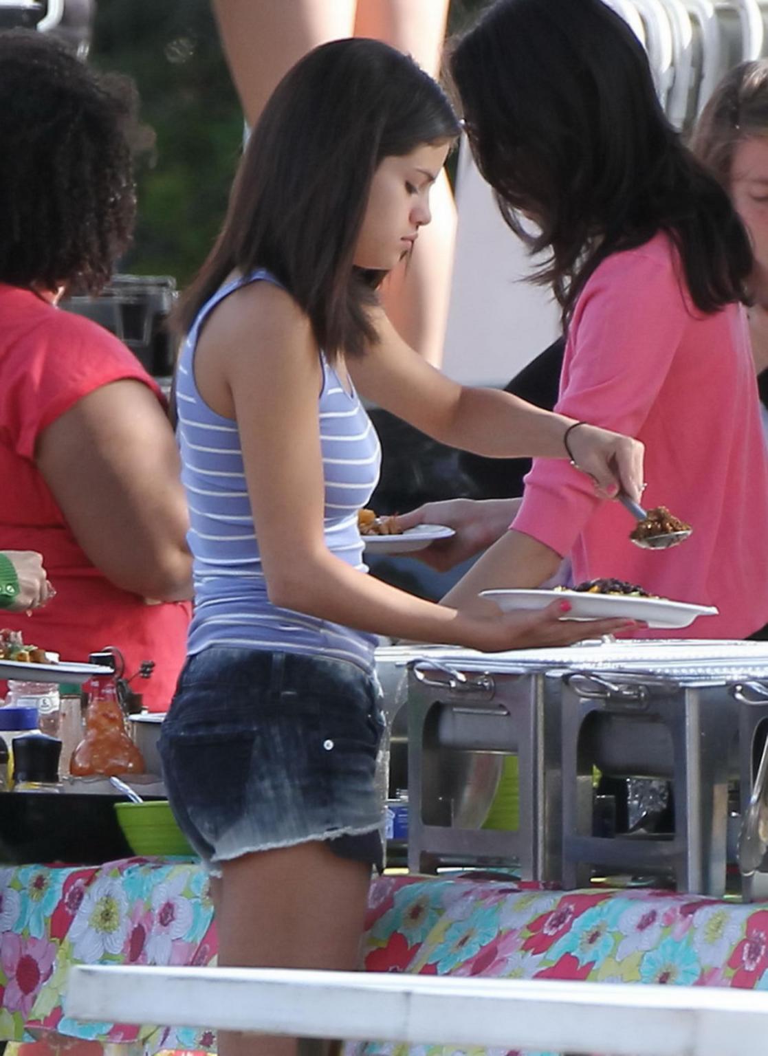 16P Selena Gomez leggy  shows pokies wearing a denim shorts  a tank top on 'Spring B