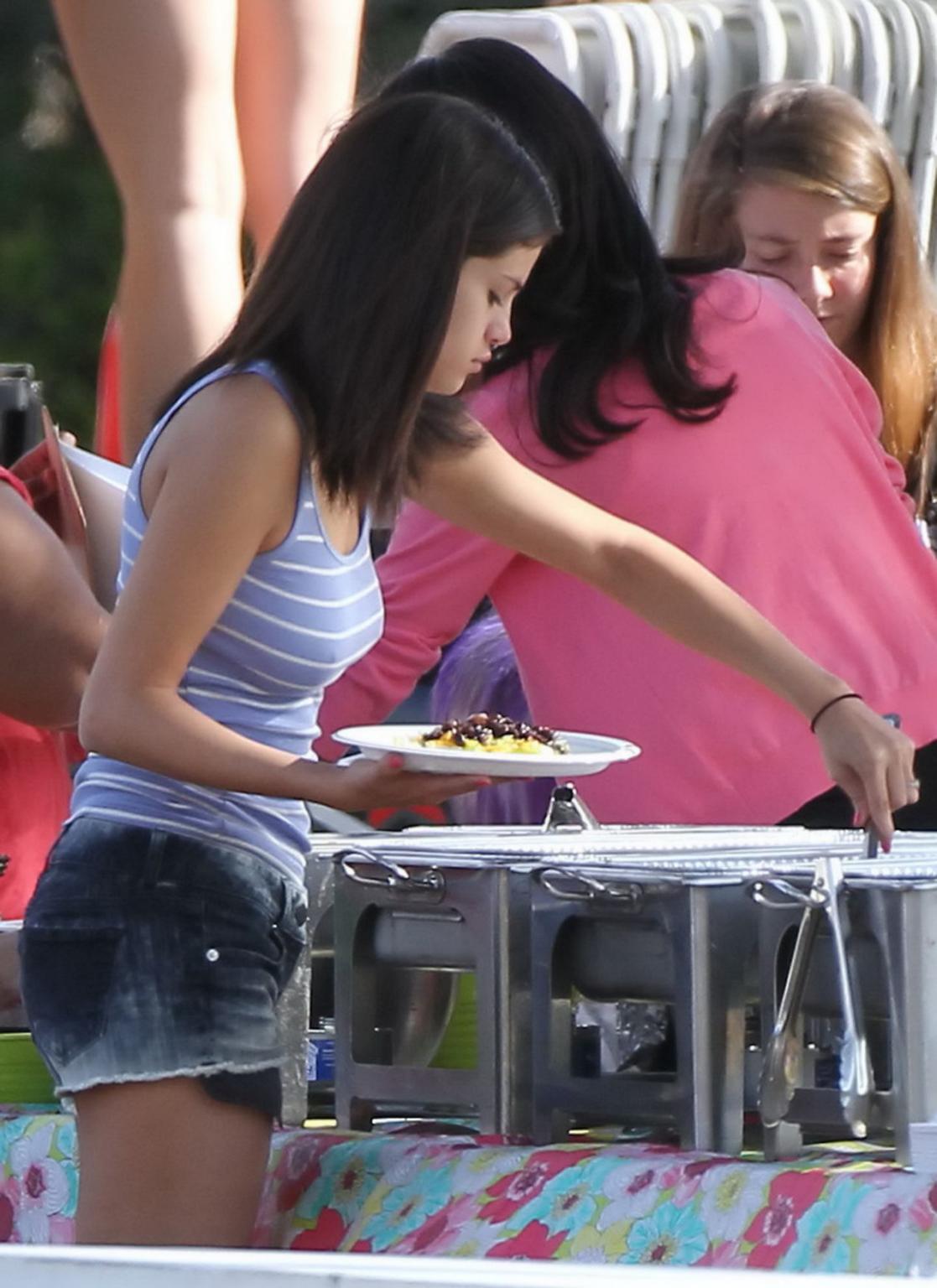 16P Selena Gomez leggy  shows pokies wearing a denim shorts  a tank top on 'Spring B