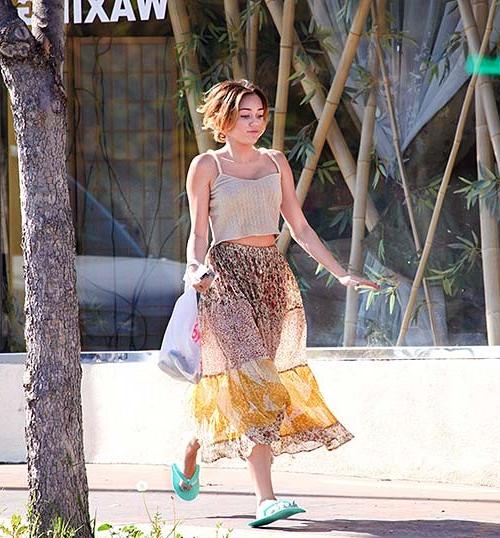 16P Miley Cyrus exposing sexy body and hot legs in see thru dress