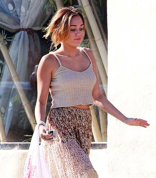 16P Miley Cyrus exposing sexy body and hot legs in see thru dress