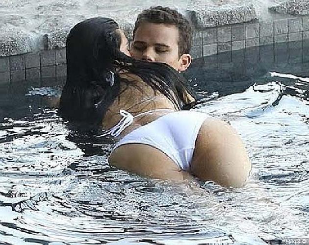 16P Kim Kardashian exposing huge boobs in bikini top on private photos