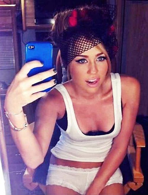 16P Miley Cyrus exposing sexy body and hard nipples in see thru blouse
