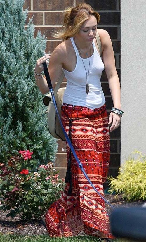 16P Miley Cyrus exposing sexy body and hard nipples in see thru blouse