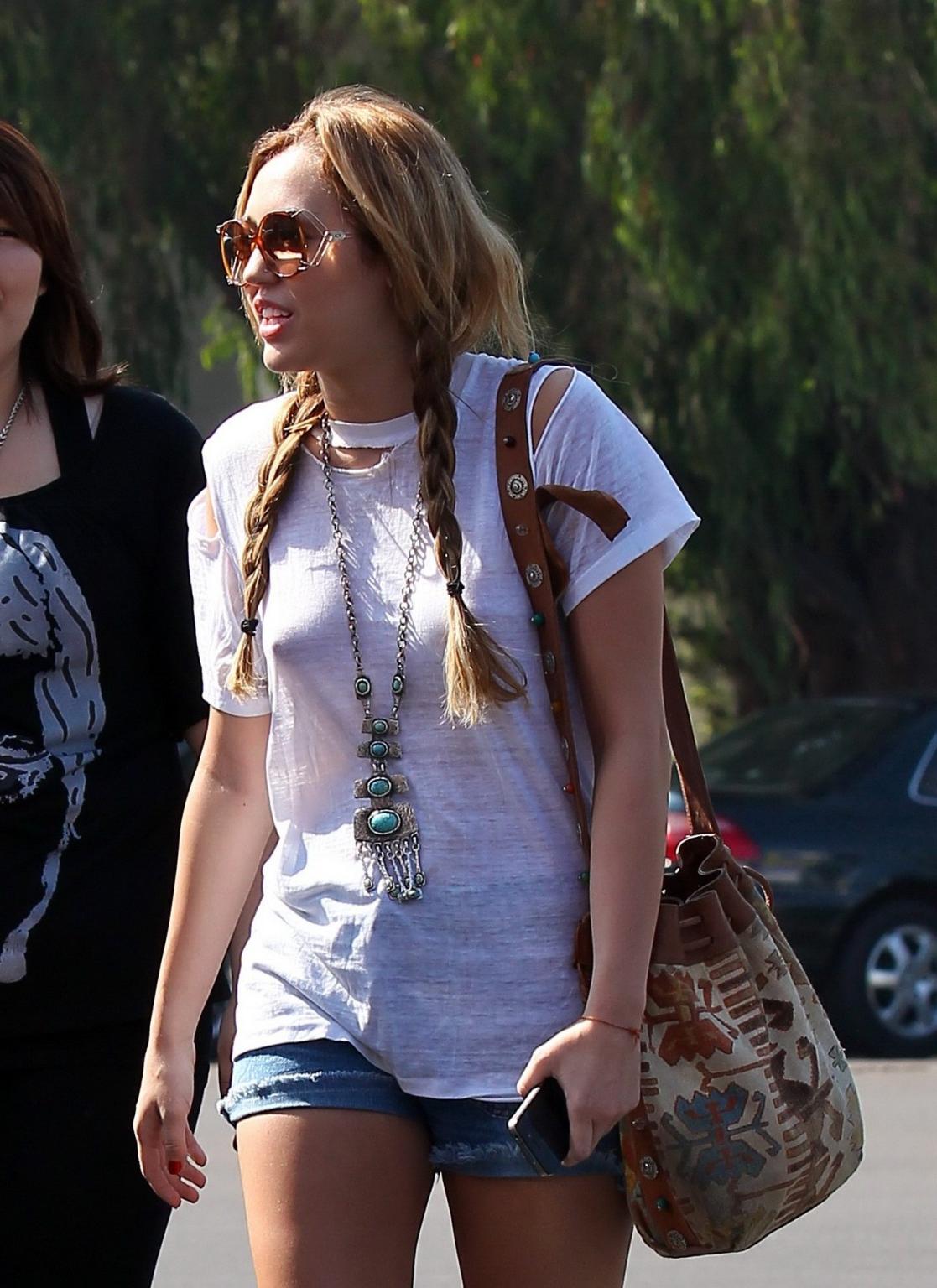 16P Miley Cyrus braless wearing see through T-shirt outside Patty's Rest in Toluca L