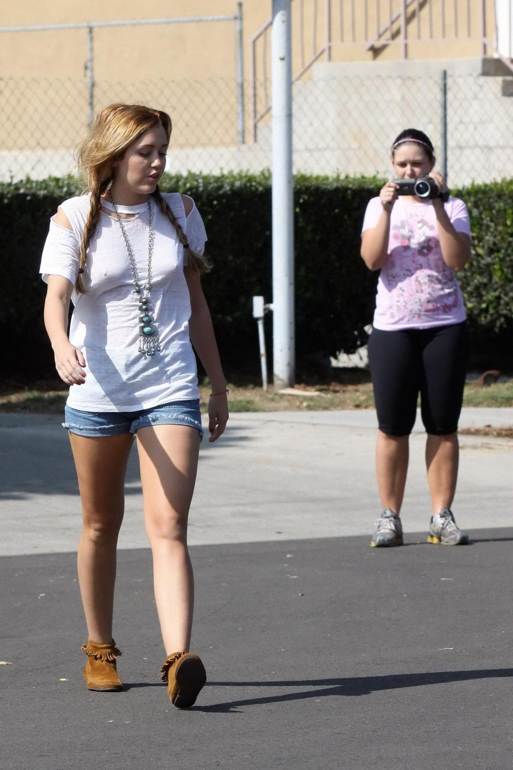 16P Miley Cyrus braless wearing see through T-shirt outside Patty's Rest in Toluca L