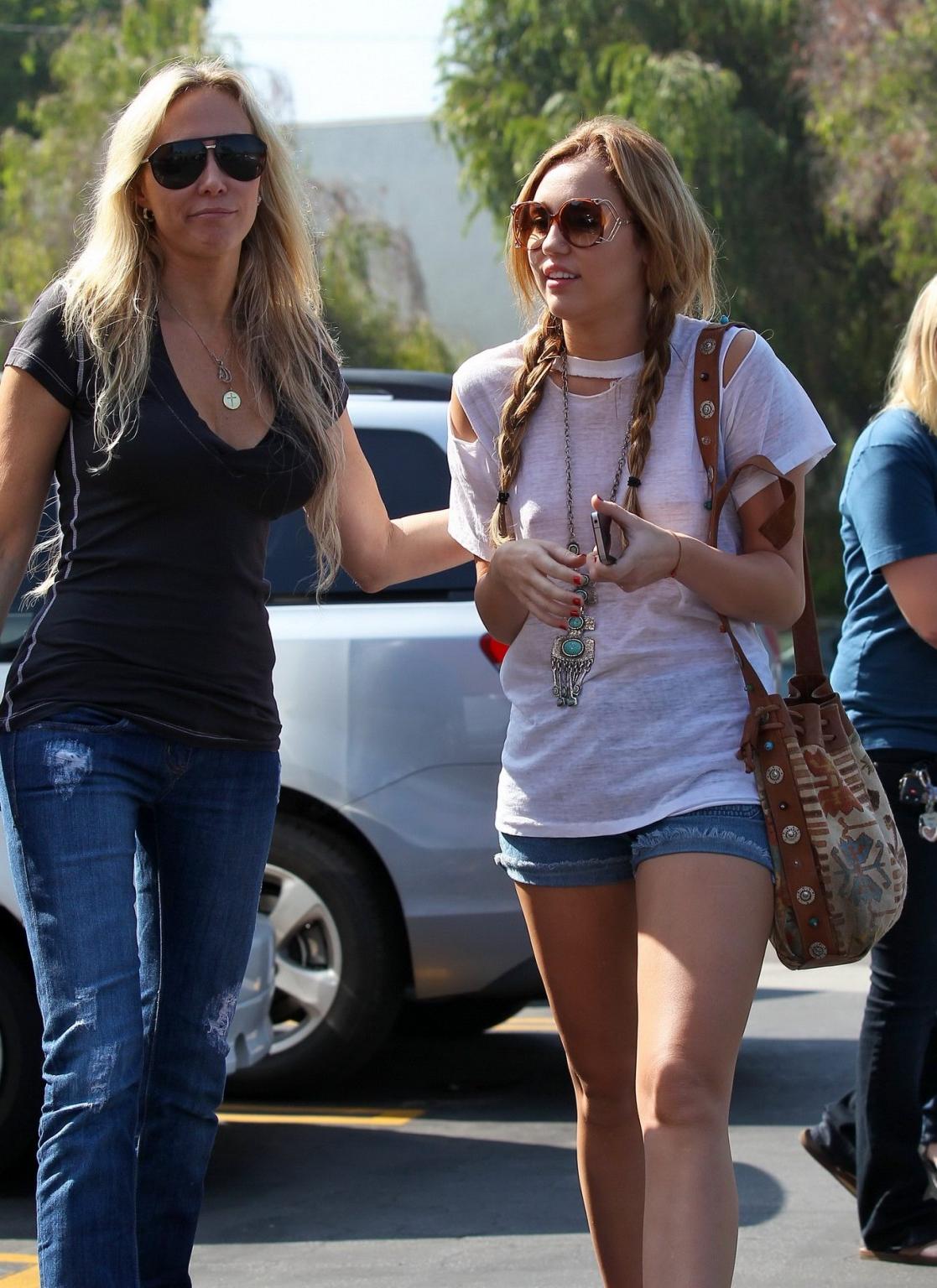 16P Miley Cyrus braless wearing see through T-shirt outside Patty's Rest in Toluca L