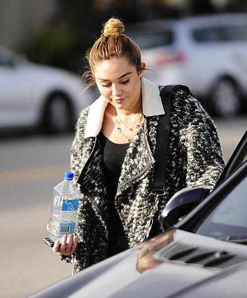 16P Miley Cyrus exposing sexy body and tiny tits in see thru blouse