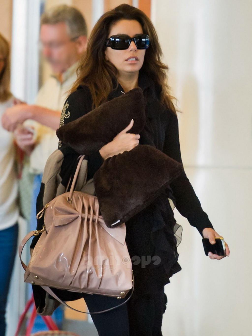 16P Eva Longoria showing off her ass in see through tights at LAX Airport