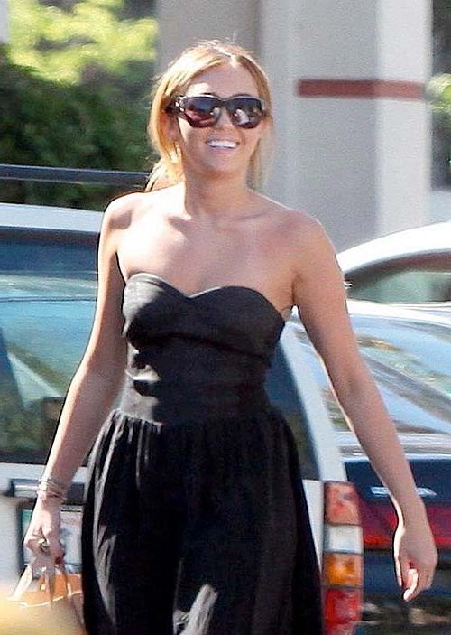 16P Miley Cyrus exposing sexy body and hard nipples in see thru blouse