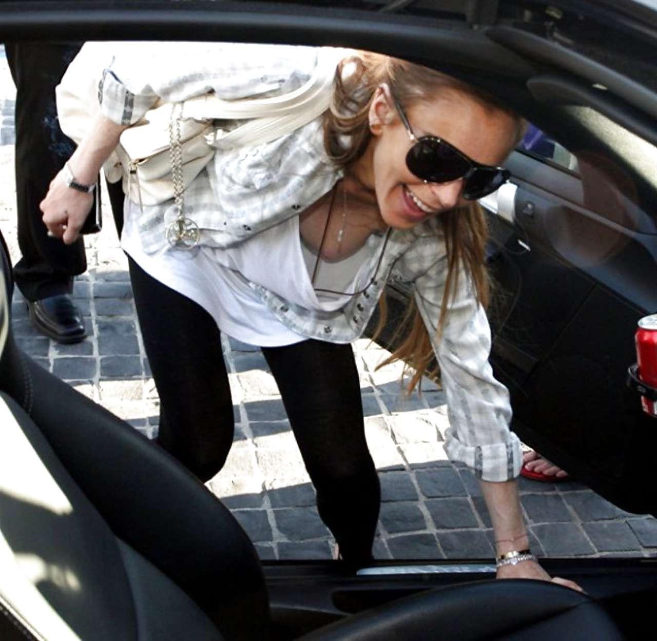 16P Lindsay Lohan showing her tits downblouse and in see thru paparazzi photos