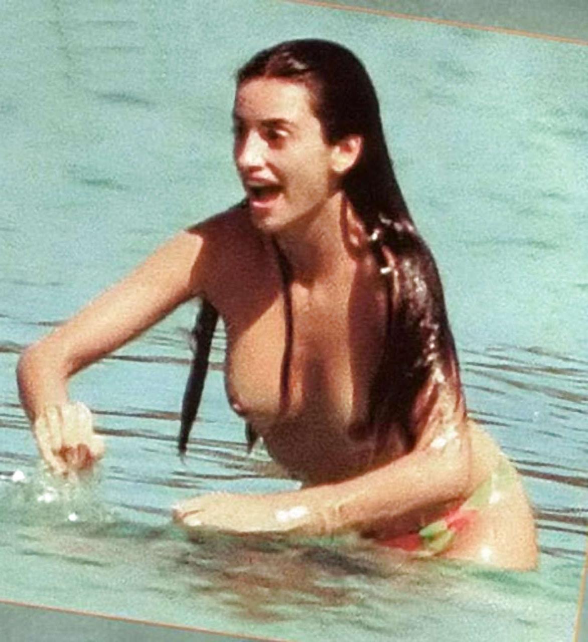 16P Penelope Cruz giving paparazzi great view on her tits on beach