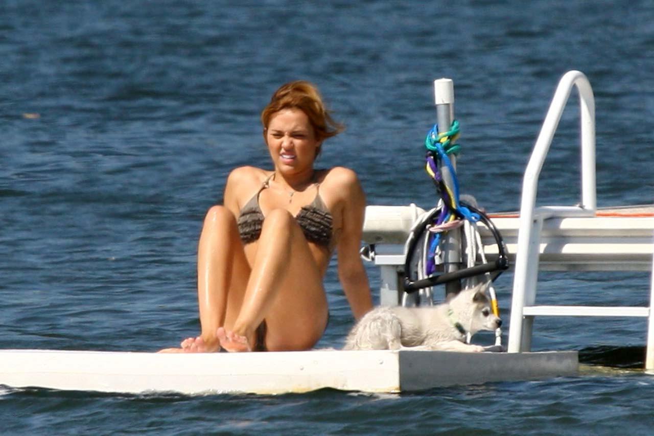 16P Miley Cyrus smoking cigars and exposing her hard nipples in see thru blouse