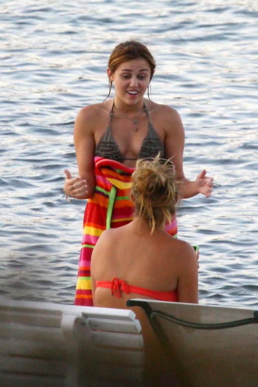 16P Miley Cyrus smoking cigars and exposing her hard nipples in see thru blouse
