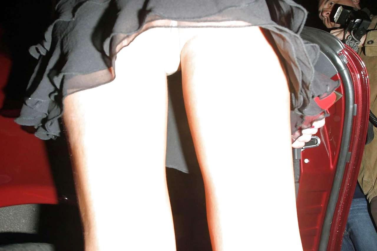 16P Abi Titmuss showing her ass upskirt on street and nice tits in see thru top papa