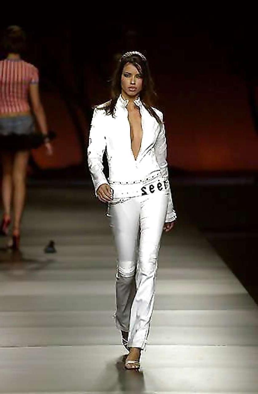 16P Adriana Lima showing her great boobs in see thru top and nice ass in thong