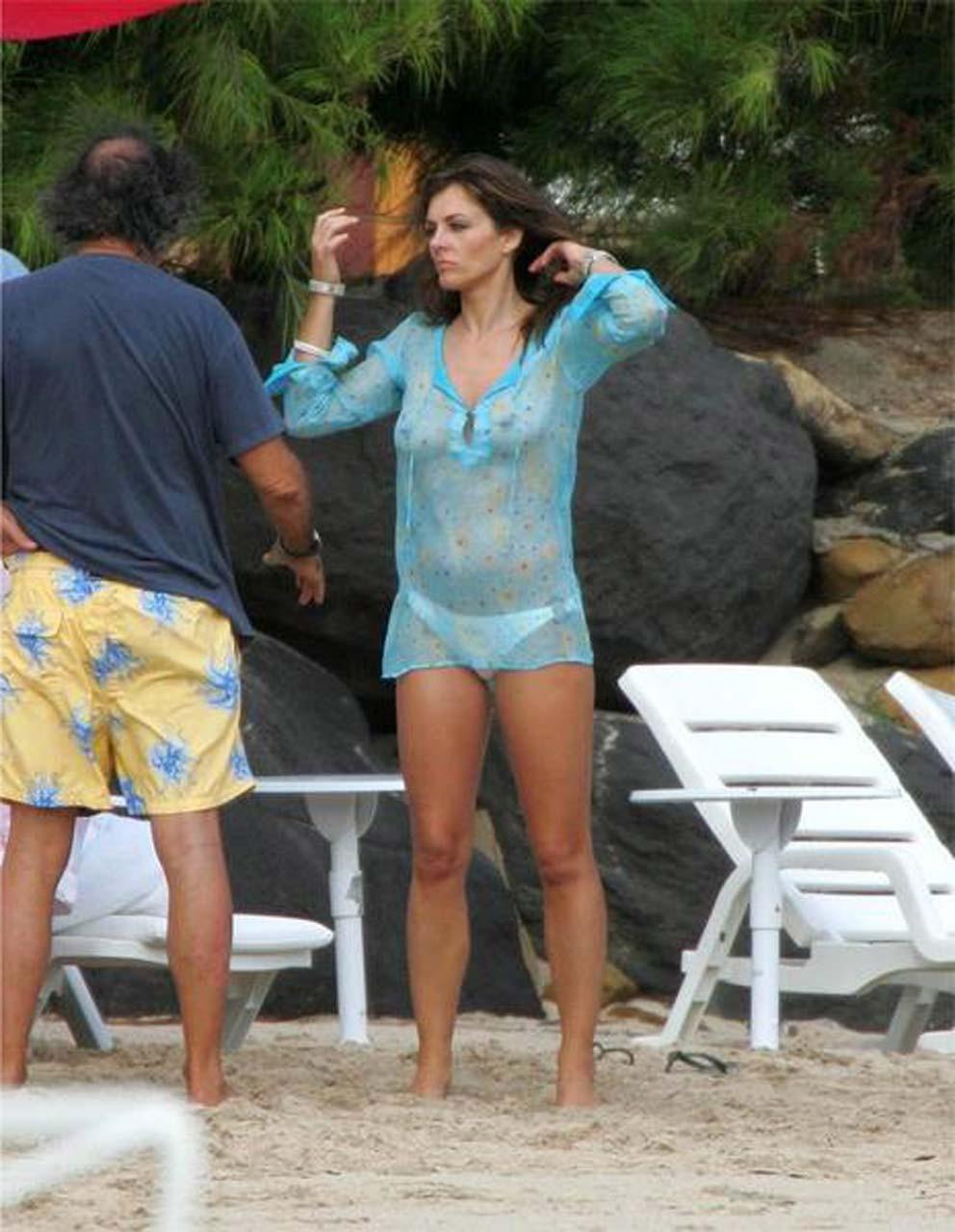 16P Elizabeth Hurley exposing her nice huge boobs in see thru top paparazzi pictures