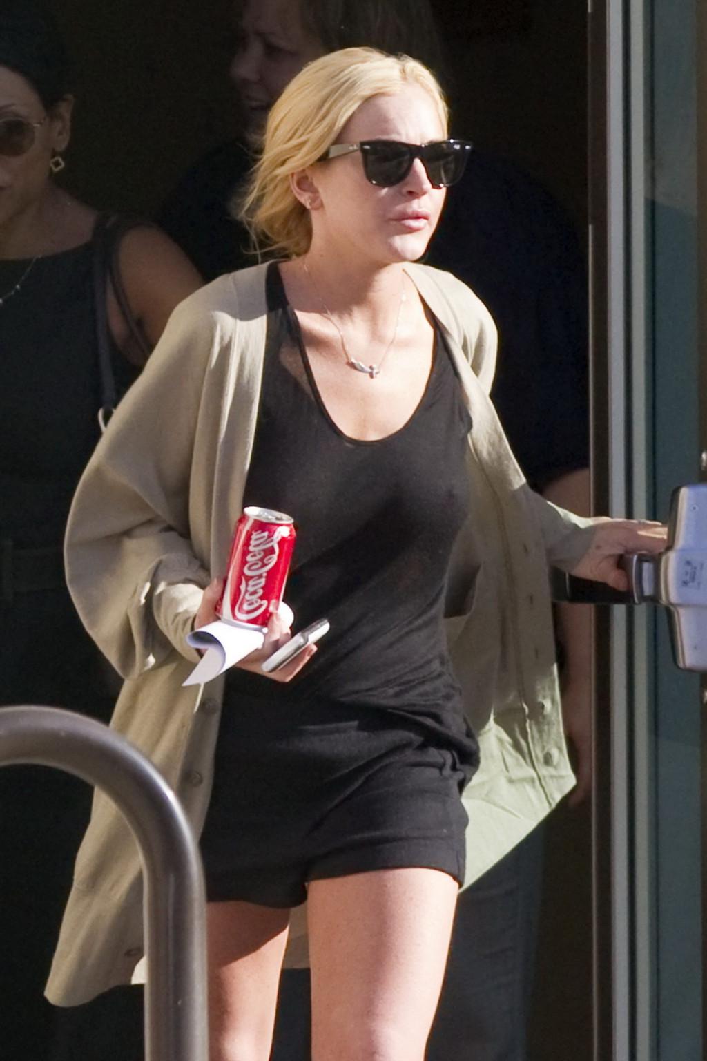 16P Lindsay Lohan shows off her boobs wearing see through top at the Downtown Women'