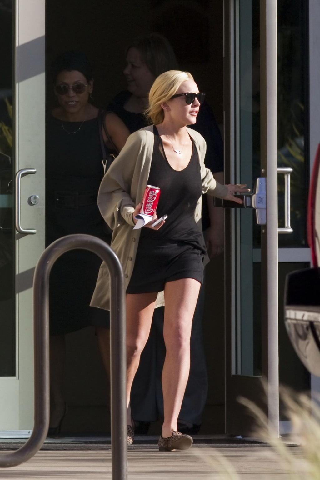 16P Lindsay Lohan shows off her boobs wearing see through top at the Downtown Women'