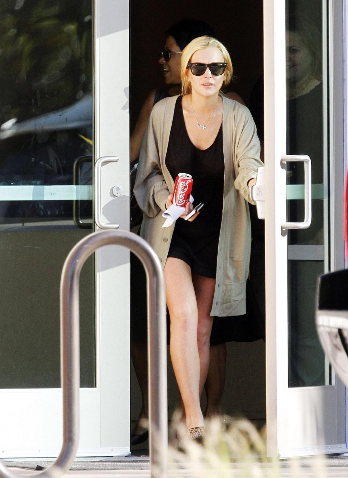16P Lindsay Lohan shows off her boobs wearing see through top at the Downtown Women'