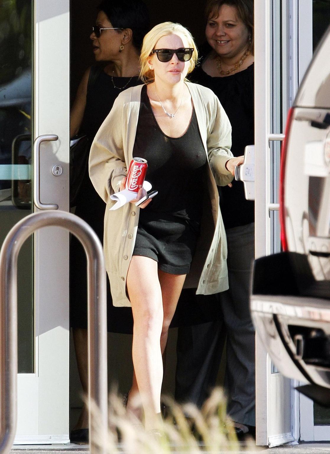 16P Lindsay Lohan shows off her boobs wearing see through top at the Downtown Women'