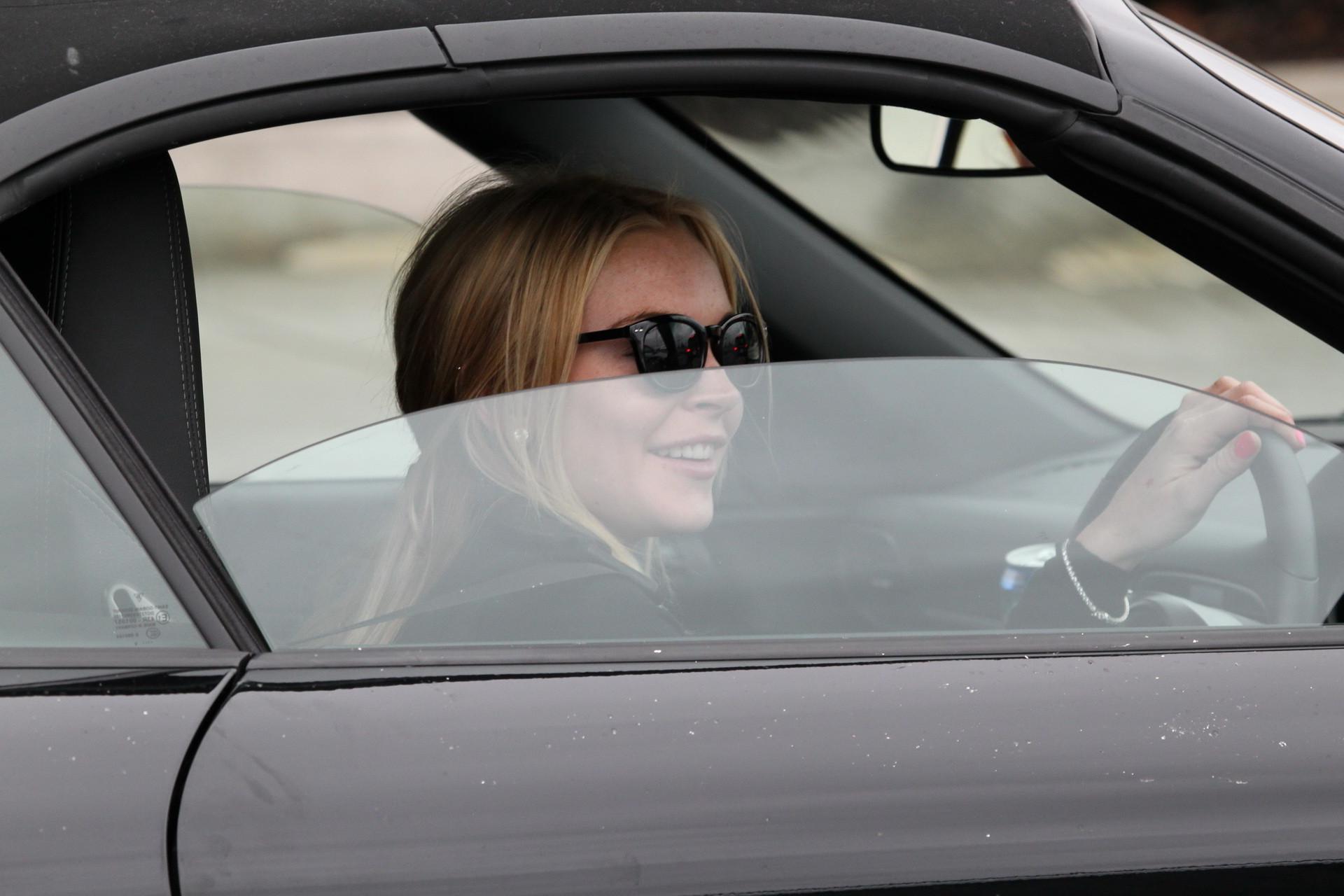 16P Lindsay Lohan showing off her big boobs wearing see-through top in LA