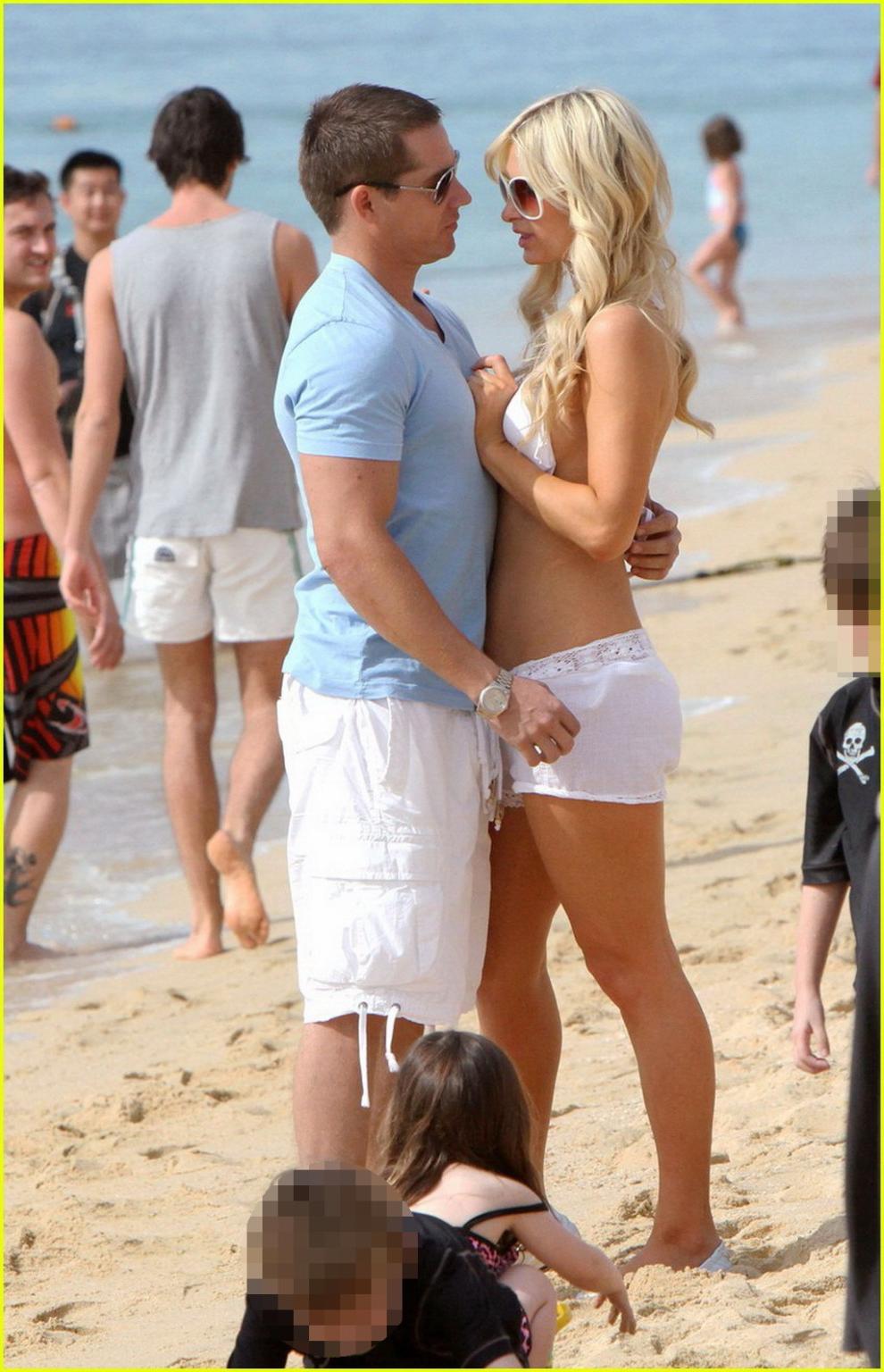 16P Paris Hilton wearing sexy white bikini  see-through shorts at the beach in Cabo 