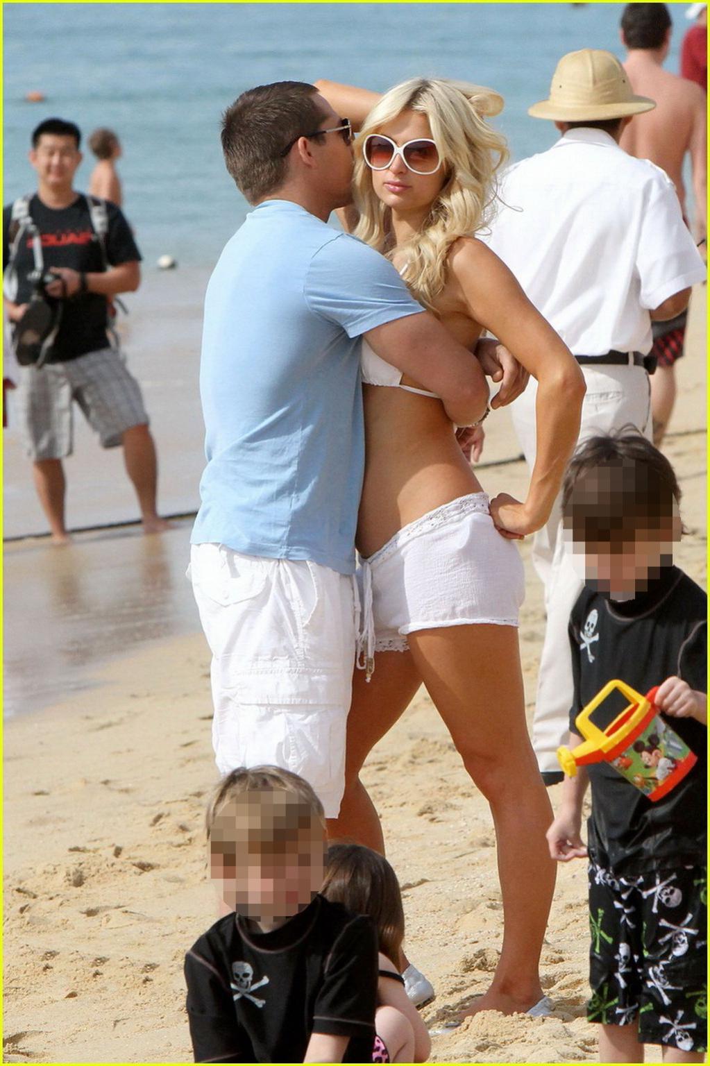 16P Paris Hilton wearing sexy white bikini  see-through shorts at the beach in Cabo 