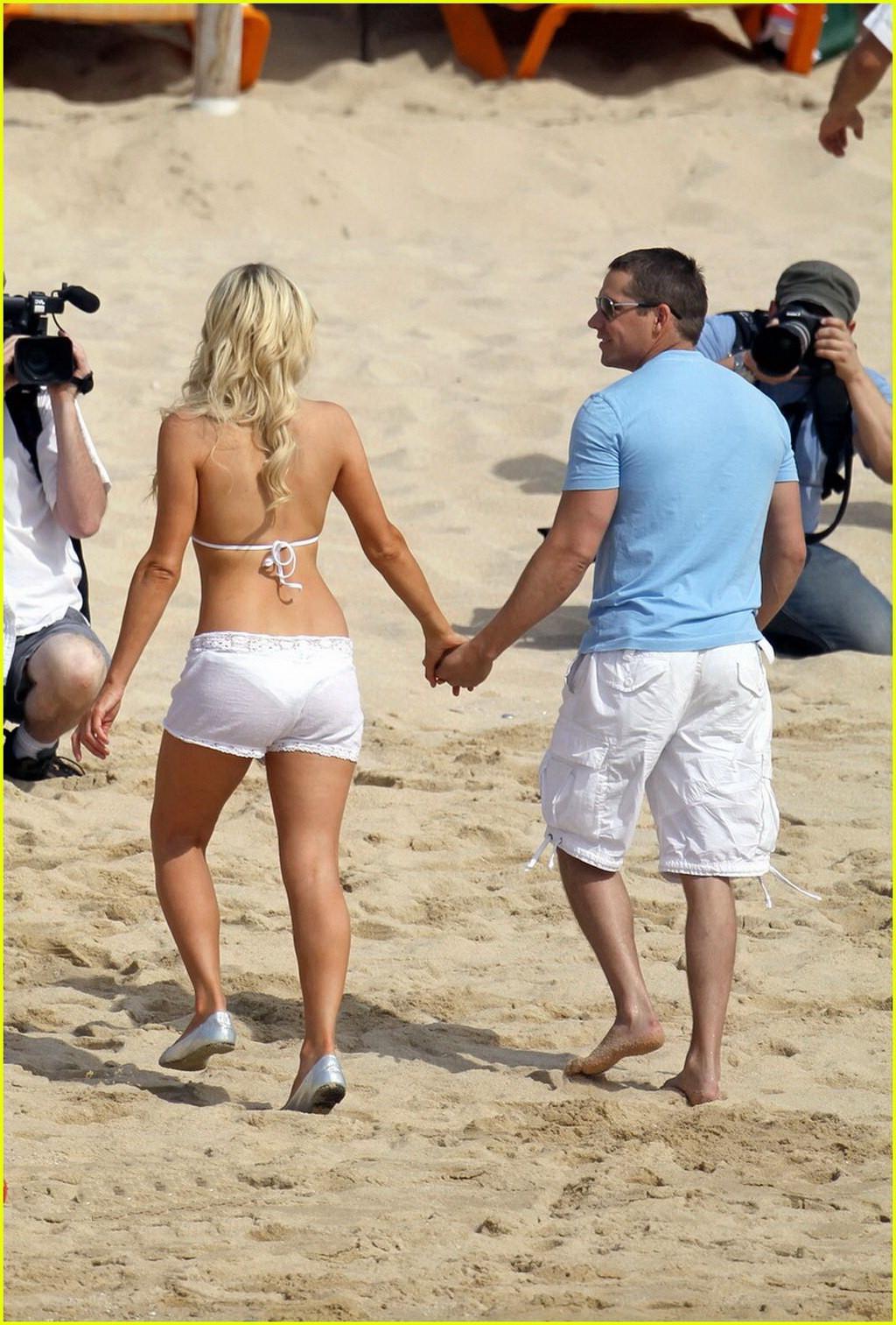 16P Paris Hilton wearing sexy white bikini  see-through shorts at the beach in Cabo 