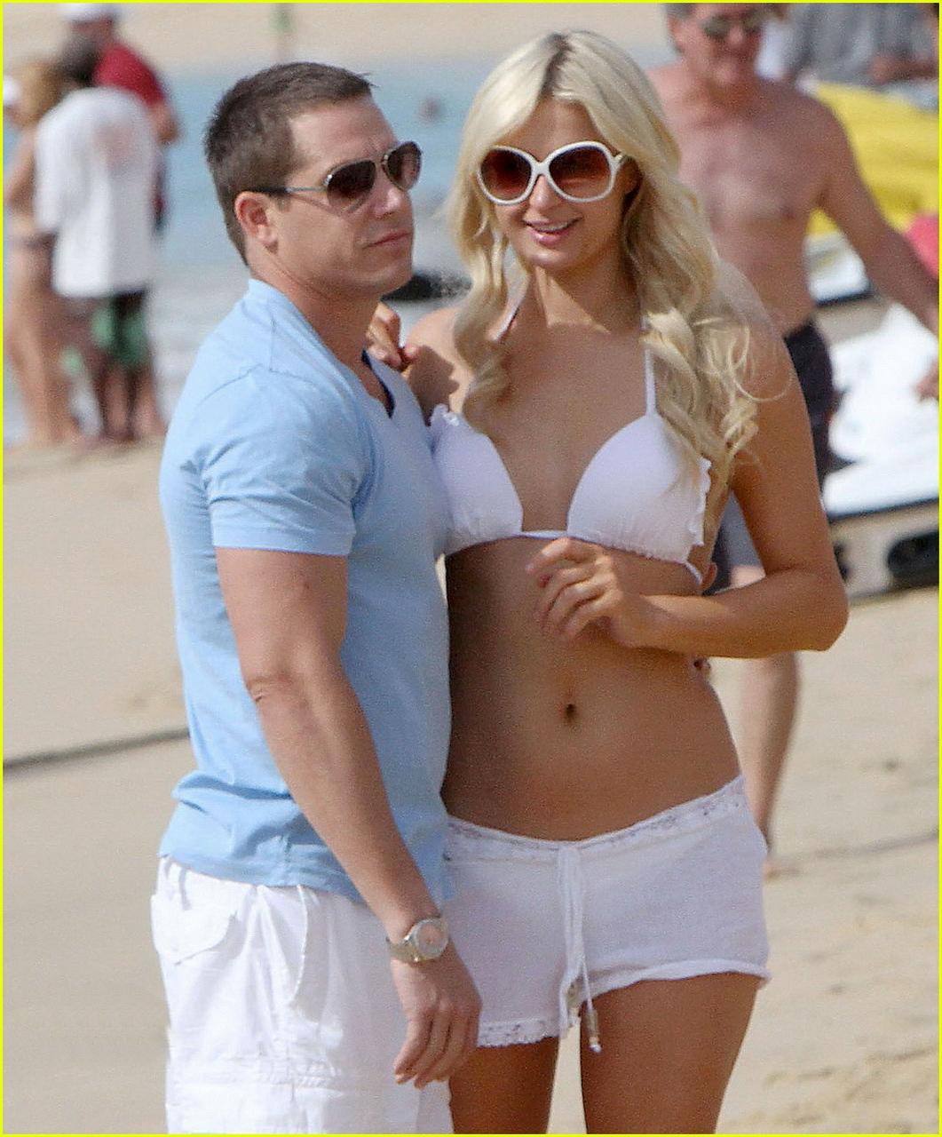 16P Paris Hilton wearing sexy white bikini  see-through shorts at the beach in Cabo 
