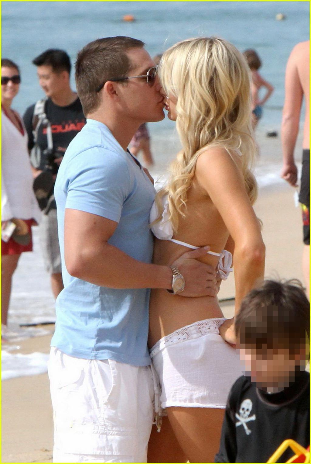 16P Paris Hilton wearing sexy white bikini  see-through shorts at the beach in Cabo 