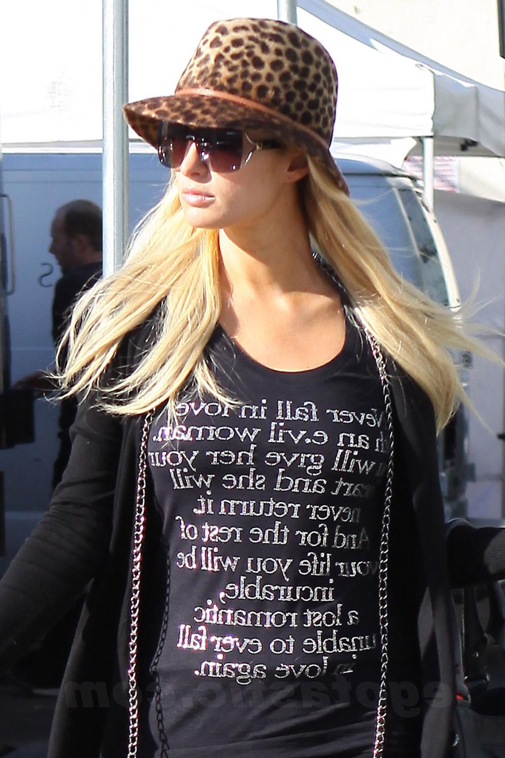 16P Paris Hilton showing off her ass in see-through tights while shopping