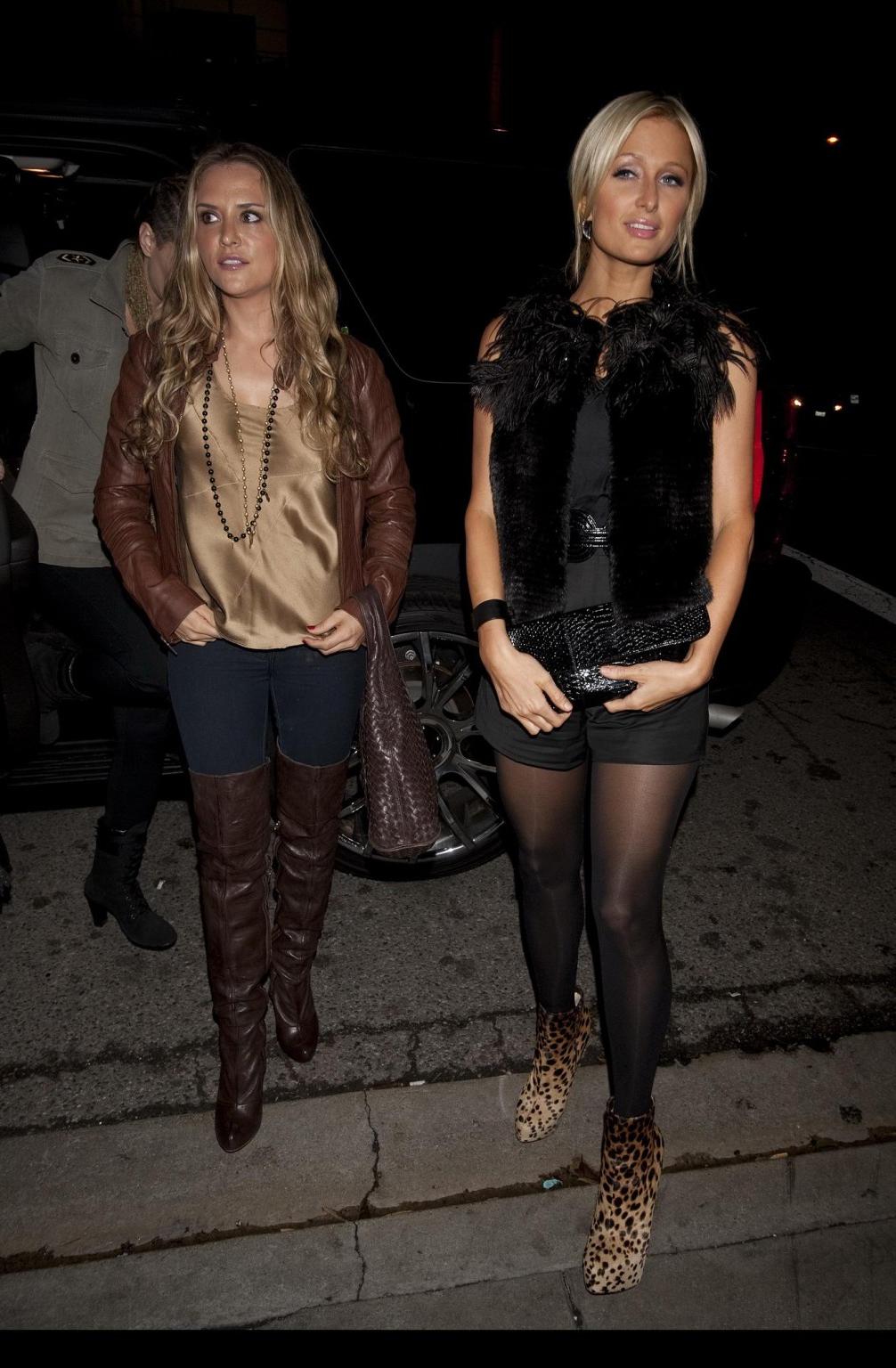 16P Paris Hilton showing off her ass in see-through tights while shopping